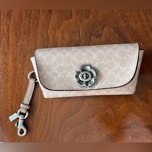 Coach glasses pouch in light tan Signature Print with silver floral turn lock!